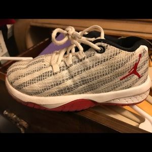 White/Gray/Red striped Jordan’s